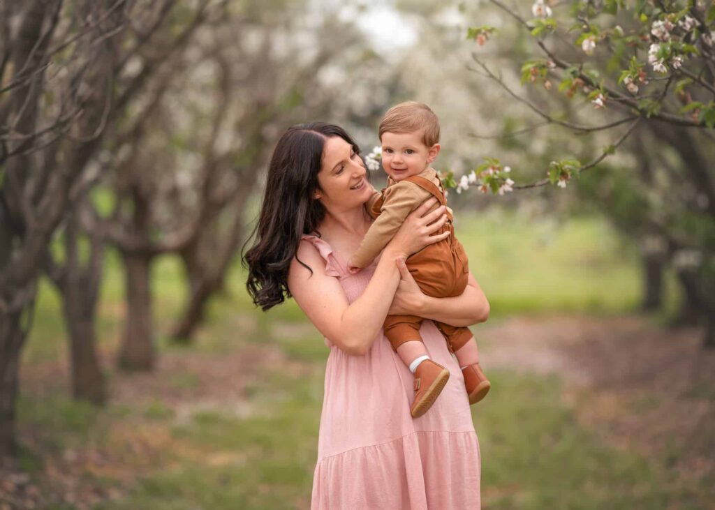 Melbourne mum holding baby during outdoor family Photoshoot