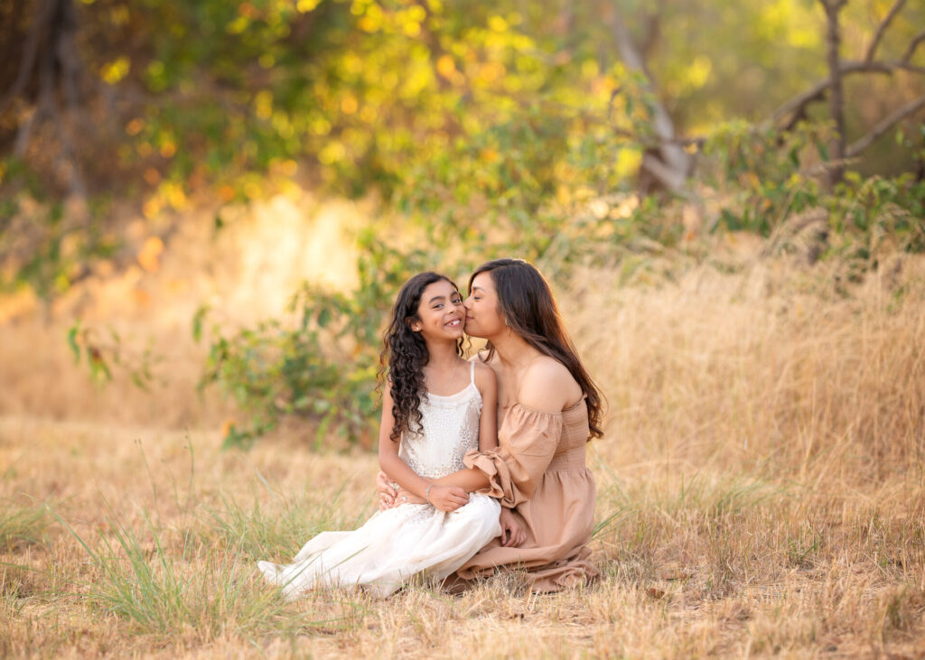 Mum with her daughter on her lap during outdoor Melbourne family photos session