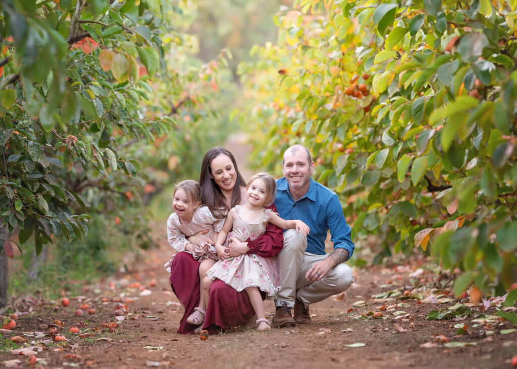 playful, candid Melbourne family photos. Mum and dad holding kids.